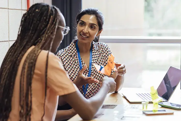 Teacher and student working with a learning model. Featured Image
